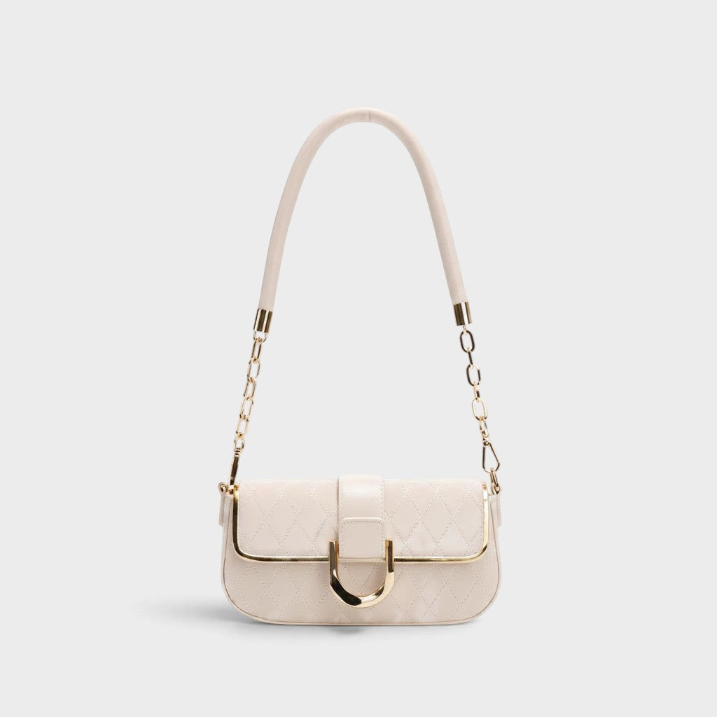 VALENORA Zara cream quilted shoulder bag with a slim profile, gold hardware, and a decorative chain-link strap.