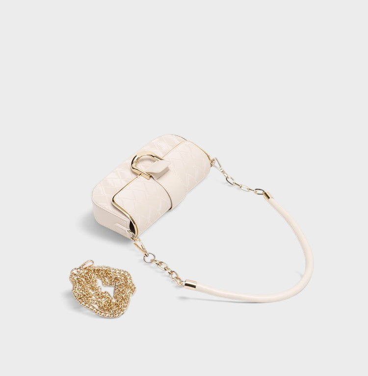VALENORA Zara cream quilted shoulder bag with gold chain-link strap and metallic clasp detail on a white background