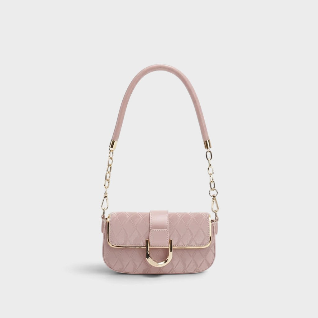 VALENORA Zara shoulder bag in dusty pink with a quilted exterior, gold hardware, and a chain-link strap.